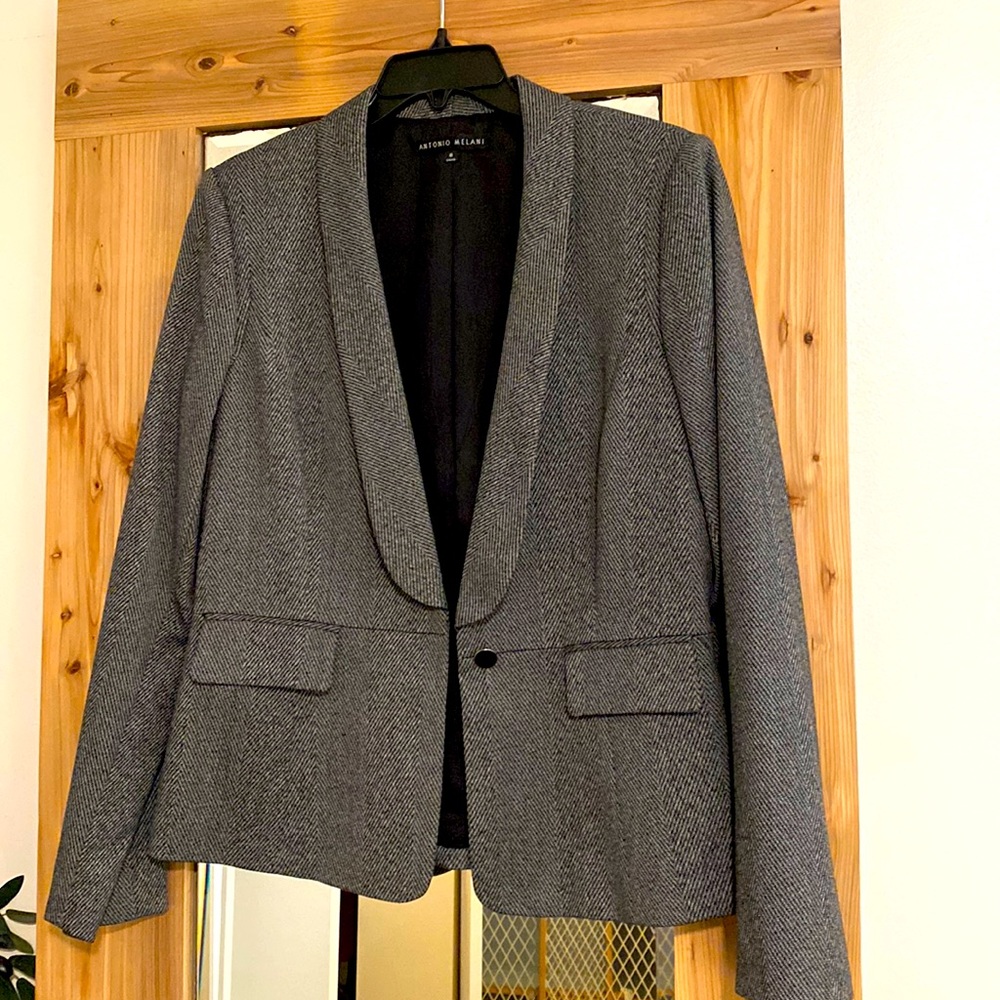 Women’s charcoal tailored blazer.